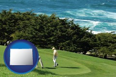 colorado map icon and two golfers on the green at an oceanside golf course
