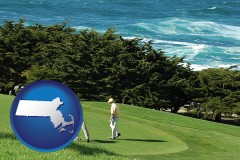massachusetts map icon and two golfers on the green at an oceanside golf course