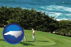 north-carolina map icon and two golfers on the green at an oceanside golf course