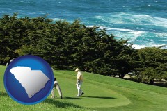 south-carolina map icon and two golfers on the green at an oceanside golf course